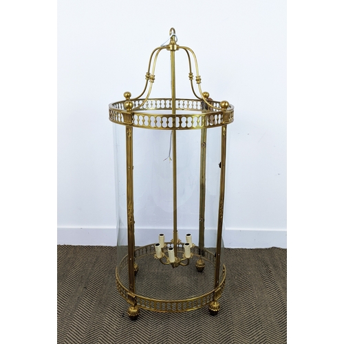 394 - HALL LANTERN, Regency style gilt metal with curved glass panels, 122cm H x 53cm W.