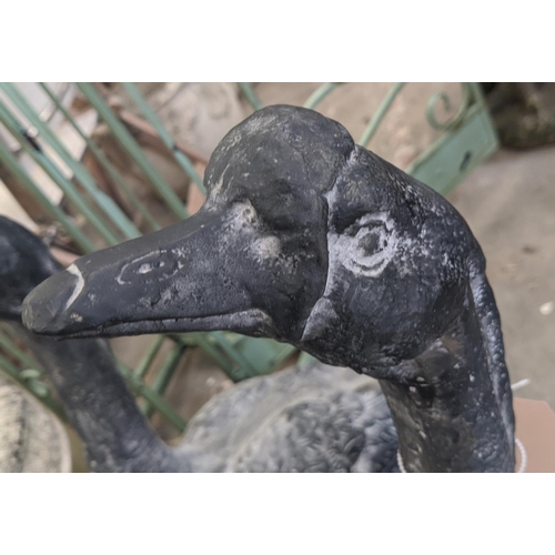 415 - SCULPTURAL GEESE, a set of two, cast metal, 75cm H approx. (2)