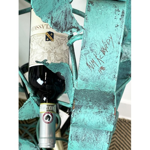 212 - N. M. KENNEDY SCULPTURED WINE RACK, scrolling grapevine metal work, in painted Verdigris finish, sig... 