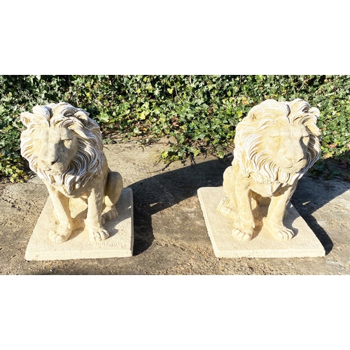 431 - SCULPTURAL LIONS, a pair, composite stone, 70cm H x 42cm W x 65cm D (2)