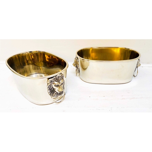 432 - CHAMPAGNE BUCKETS, a pair, polished meal with lion's head handles, 16cm H x 45cm x 26cm. (2)