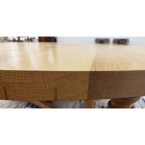 311 - DINING CENTRE TABLE, hand joined oak with circular top on tripartite baluster columns and shared str... 