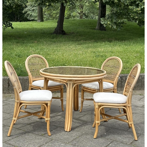 474 - ORANGERY STYLE TABLE, circular rattan and cane bound with glazed top together with four matching sid... 