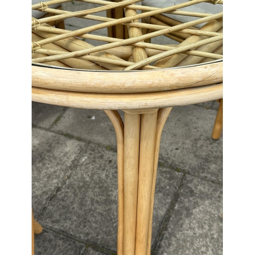 474 - ORANGERY STYLE TABLE, circular rattan and cane bound with glazed top together with four matching sid... 