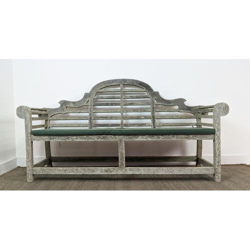 101 - GARDEN BENCH, Lutyens style in a weathered finish, 195cm x 58cm x 106cm H with green cushion.