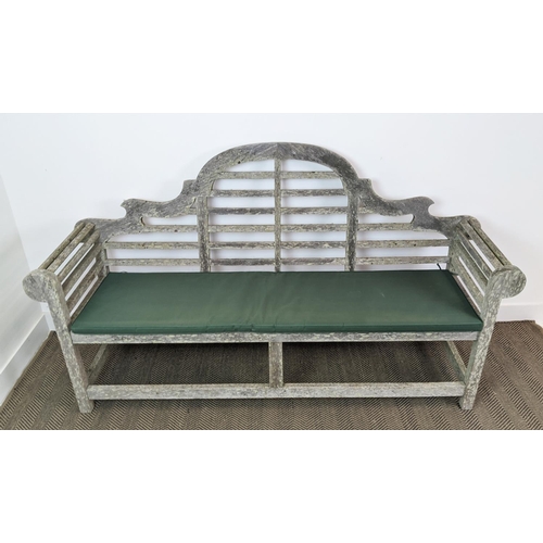 101 - GARDEN BENCH, Lutyens style in a weathered finish, 195cm x 58cm x 106cm H with green cushion.