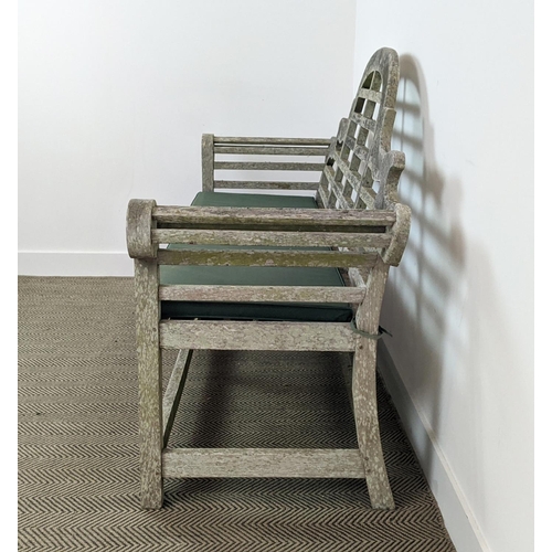 101 - GARDEN BENCH, Lutyens style in a weathered finish, 195cm x 58cm x 106cm H with green cushion.