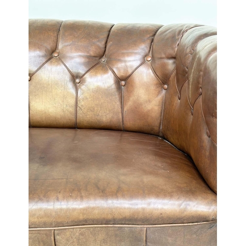 129 - DANISH SOFA, early 20th century Art Deco Danish button tan hide leather with arched back, rounded ar... 