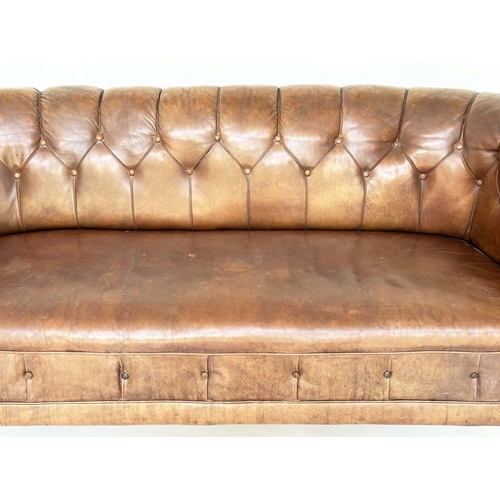 129 - DANISH SOFA, early 20th century Art Deco Danish button tan hide leather with arched back, rounded ar... 