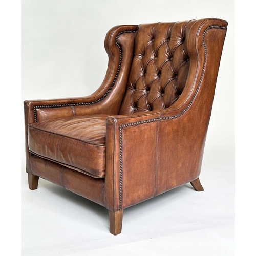 131 - LIBRARY ARMCHAIR, hand finished soft tan brown leather upholstered with button back and brass studdi... 