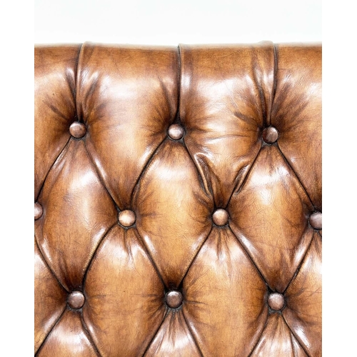 131 - LIBRARY ARMCHAIR, hand finished soft tan brown leather upholstered with button back and brass studdi... 