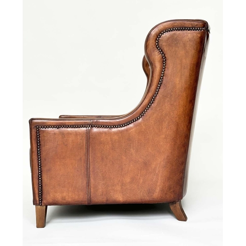 131 - LIBRARY ARMCHAIR, hand finished soft tan brown leather upholstered with button back and brass studdi... 