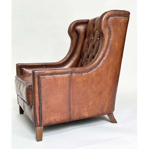 131 - LIBRARY ARMCHAIR, hand finished soft tan brown leather upholstered with button back and brass studdi... 