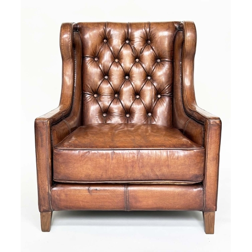 131 - LIBRARY ARMCHAIR, hand finished soft tan brown leather upholstered with button back and brass studdi... 