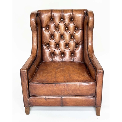 131 - LIBRARY ARMCHAIR, hand finished soft tan brown leather upholstered with button back and brass studdi... 