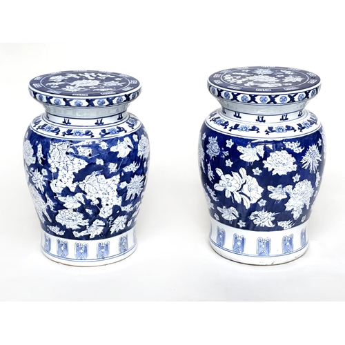 135 - CHINESE STOOLS, a pair, Chinese blue and white ceramic of vase form with fruiting vines and flowers,... 