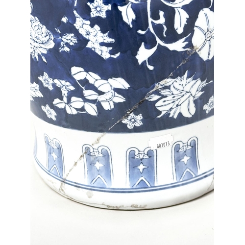 135 - CHINESE STOOLS, a pair, Chinese blue and white ceramic of vase form with fruiting vines and flowers,... 