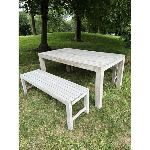 155 - PANAMA GARDEN BENCHES AND TABLE, a pair, rectangular well weathered slatted teak together with match... 