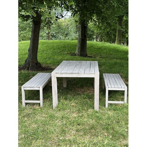 155 - PANAMA GARDEN BENCHES AND TABLE, a pair, rectangular well weathered slatted teak together with match... 