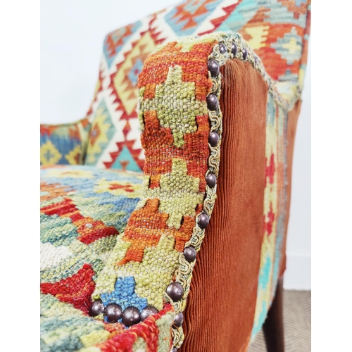 159 - ARMCHAIR, 19th century beechwood in kilim and corduroy with front castors, 87cm H x 66cm x 74cm.