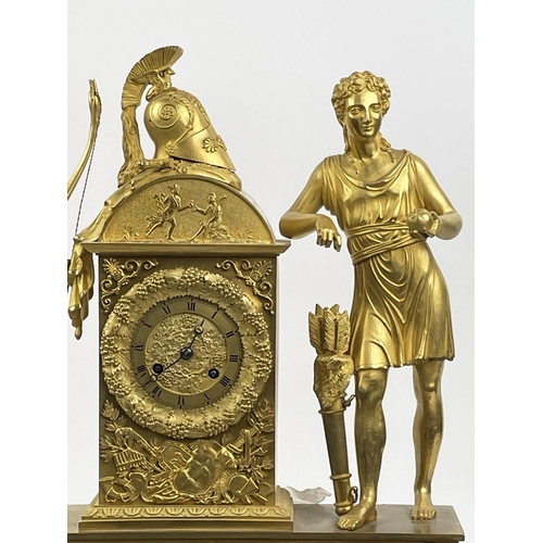 16 - MANTLE CLOCK, 19th century French Empire gilt bronze, with Diana the huntress figure holding an appl... 