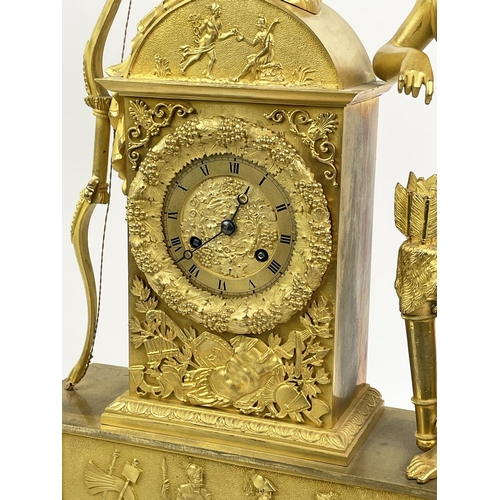 16 - MANTLE CLOCK, 19th century French Empire gilt bronze, with Diana the huntress figure holding an appl... 