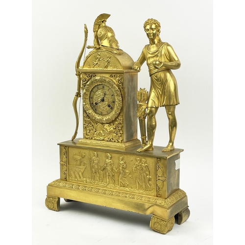 16 - MANTLE CLOCK, 19th century French Empire gilt bronze, with Diana the huntress figure holding an appl... 