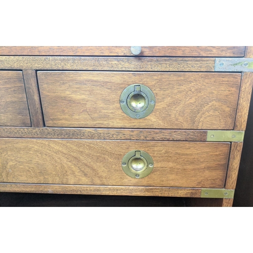 160 - CAMPAIGN STYLE CHESTS, a matched pair, brass bound, both with green leather slides, one with five dr... 