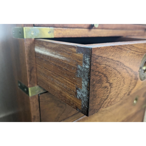 160 - CAMPAIGN STYLE CHESTS, a matched pair, brass bound, both with green leather slides, one with five dr... 