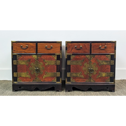 212 - BEDSIDE CABINETS, a pair, Korean elm and brass bound, each with two drawers and two doors, 42cm H x ... 