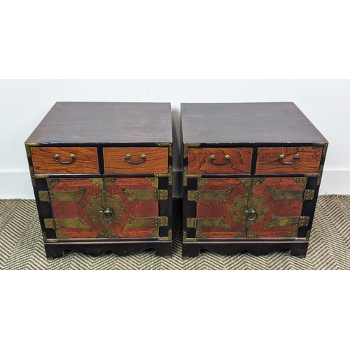 212 - BEDSIDE CABINETS, a pair, Korean elm and brass bound, each with two drawers and two doors, 42cm H x ... 