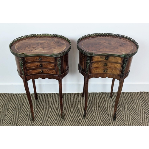 215 - BEDSIDE TABLES, a pair, kidney shaped with a 3/4 pierced brass gallery with three drawers, each 45cm... 