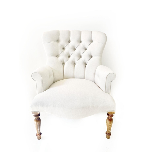 306 - ARMCHAIR, Victorian style, neutral buttoned back upholstery on turned front supports, 95cm H x 70cm ... 