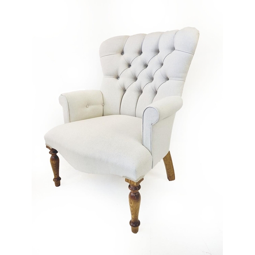 306 - ARMCHAIR, Victorian style, neutral buttoned back upholstery on turned front supports, 95cm H x 70cm ... 