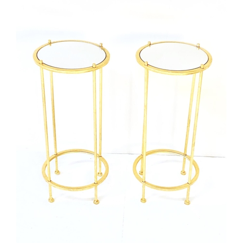 344 - SIDE TABLES, a pair, gilt metal with circular mirrored glass tops, 60cm H x 27cm W (2)