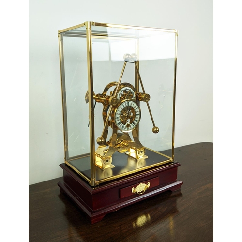 363 - SKELETON CLOCK, gilt metal in a glazed case, 55cm H x 33cm x 22cm.