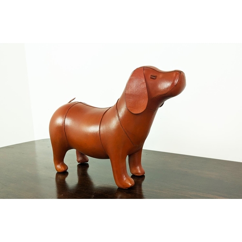 364 - DOG FOOTSTOOL, tan leather, 40cm H x 54cm x 23cm.