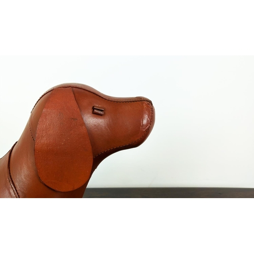 364 - DOG FOOTSTOOL, tan leather, 40cm H x 54cm x 23cm.