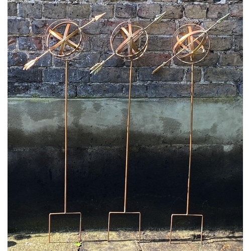 370 - ARMILLARY SPHERE GARDEN STAKES, a set of three, 115cm H x 39cm x 16cm. (3)