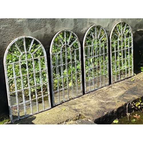 371 - ARCHITECTURAL GARDEN MIRRORS, a set of four, regency style arched metal frames in a weathered finish... 