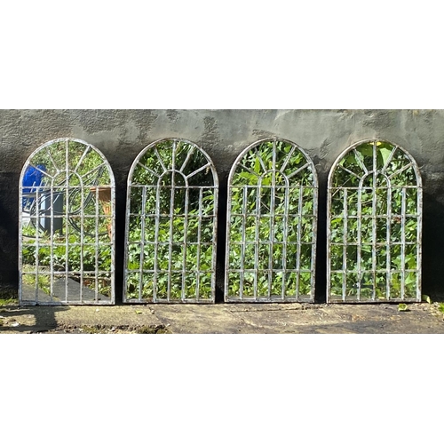 371 - ARCHITECTURAL GARDEN MIRRORS, a set of four, regency style arched metal frames in a weathered finish... 