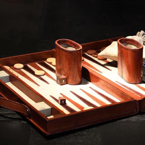 377 - BACKGAMMON SET, tan leathered case, 23cm x 40cm x 7cm H.