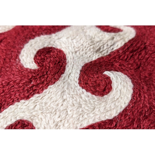 387 - OKA RUG, red and white dark woven pattern, 300cm x 240cm.