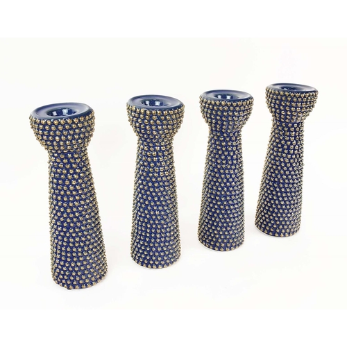 406 - CANDLESTICKS, a set of four, glazed ceramic, 30cm H. (4)