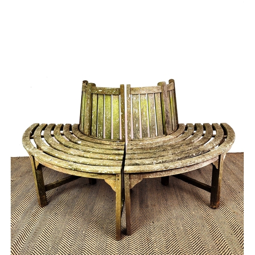 421 - TREE BENCH, weathered wood construction, splits into two sections down middle, 177cm W approx.