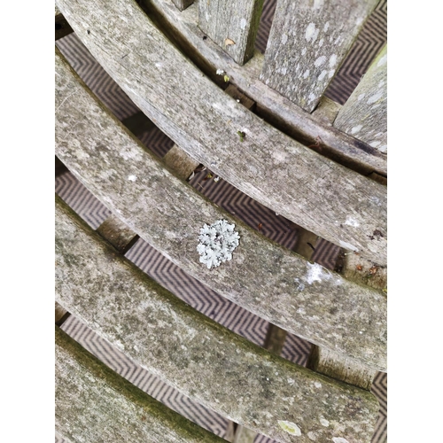 421 - TREE BENCH, weathered wood construction, splits into two sections down middle, 177cm W approx.