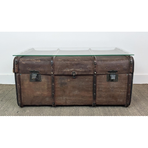 99 - TRUNK/LOW TABLE, 19th century canvas and hinged bearing name M. Nelson now adapted with a secured gl... 