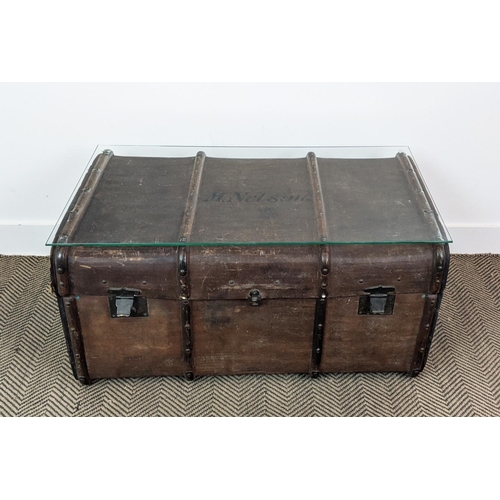 99 - TRUNK/LOW TABLE, 19th century canvas and hinged bearing name M. Nelson now adapted with a secured gl... 