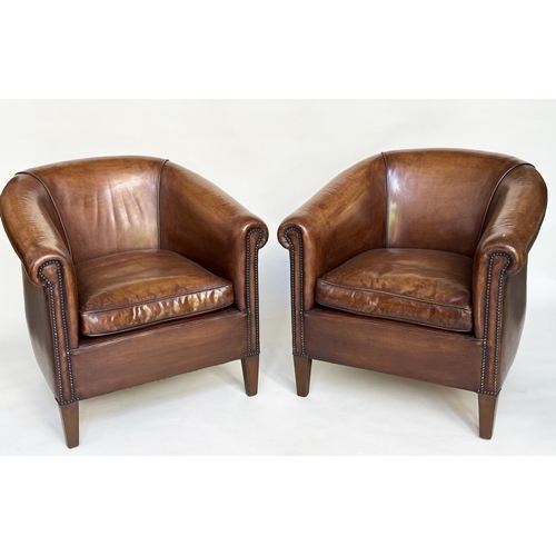 133 - TUB ARMCHAIRS, a pair, brass studded, hand finished soft tan brown leather with bar back and taperin... 