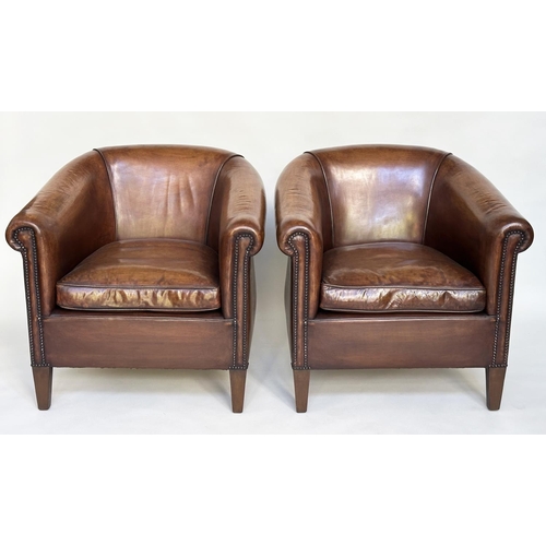 133 - TUB ARMCHAIRS, a pair, brass studded, hand finished soft tan brown leather with bar back and taperin... 